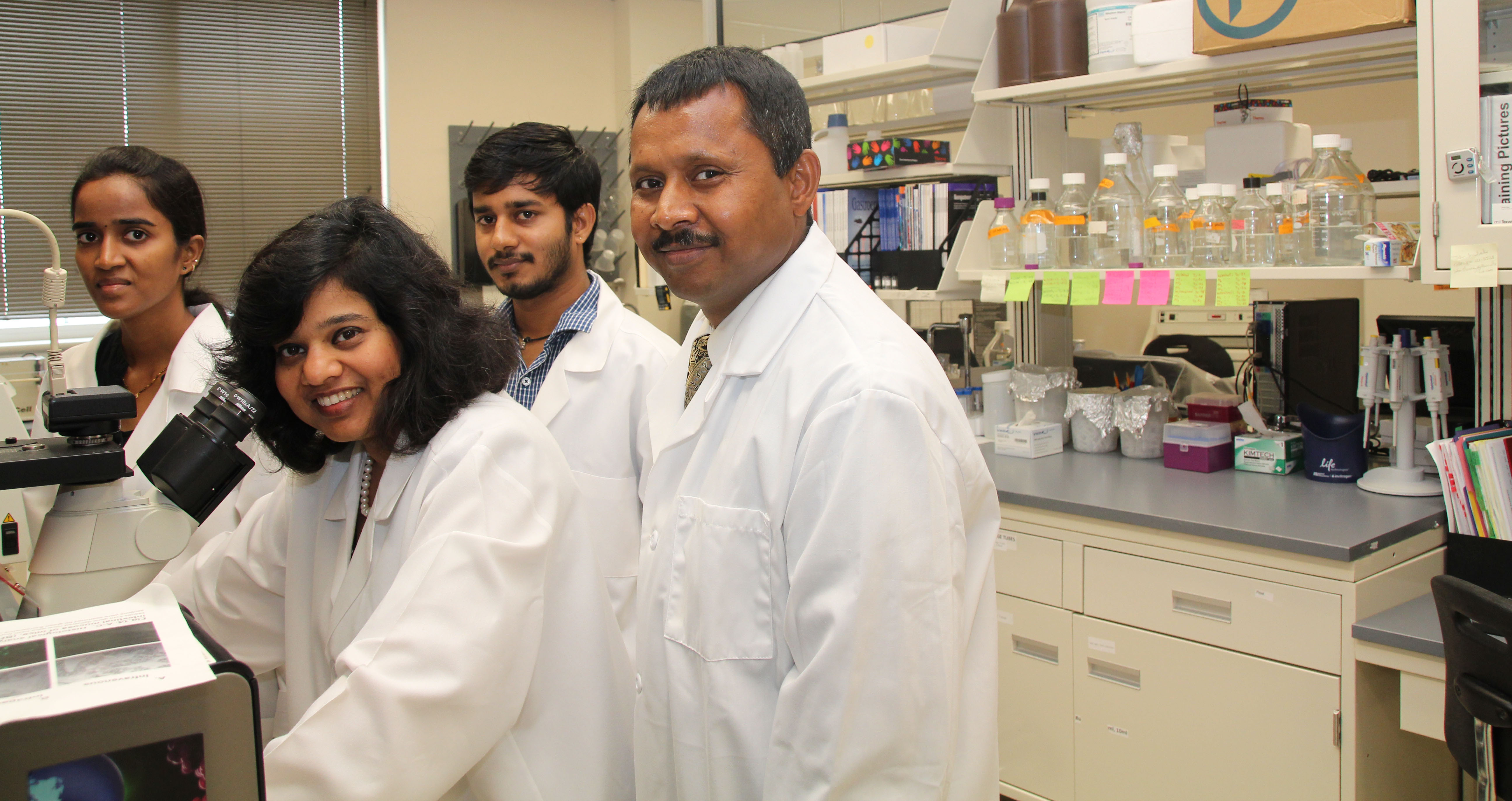 Narendra Kumar, Ph.D., associate professor of pharmaceutical sciences, Jayshree Mishra, Ph.D., research assistant, serve as co-principal investigators for a sub-contract of an NIH-funded initiative to develop a device that measure drug effectiveness. Texas A&M University-Kingsville electrical engineering graduate students Lakshmi Korrapati and Saikrishna Krishna work in the lab on the project.