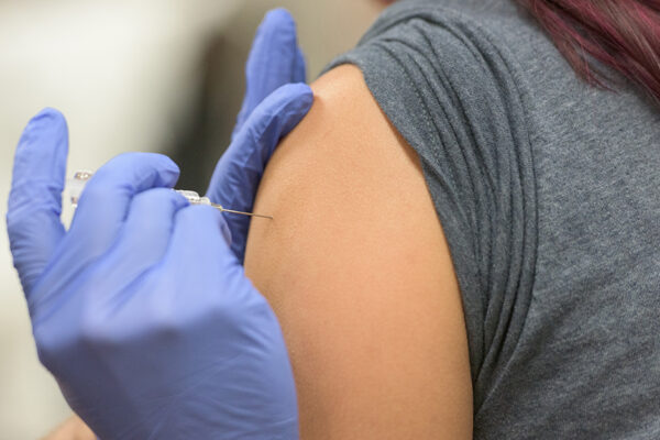 HPV Myths - A Vaccine Is Being Injected Into A Person's Upper Arm