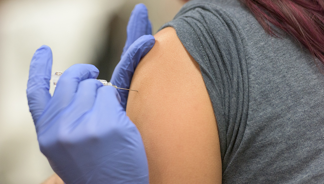 HPV myths - a vaccine is being injected into a person's upper arm