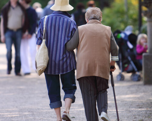 Women Helping Another Walk