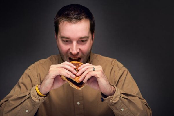 Man Eating Unhealthy Foods