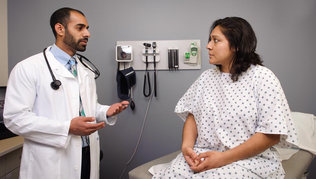 Doctor checking female patient