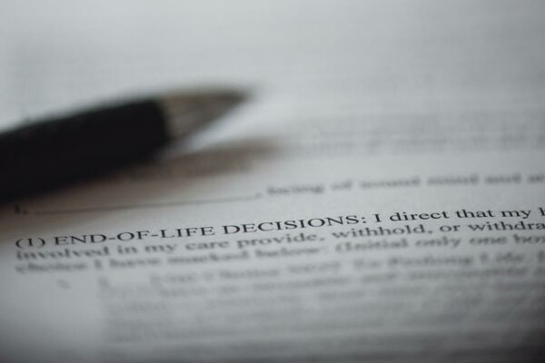 Piece Of Paper With A Closeup On The Words "End-of-Life Decisions"