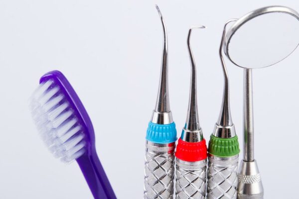 A Glass Full Of Dental Tools.