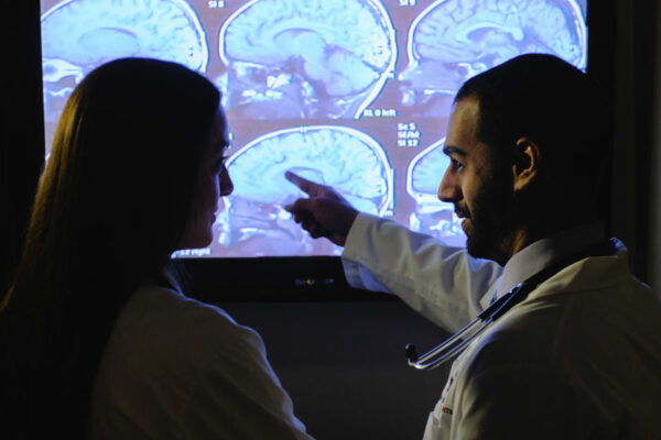 Doctors Looking At Brain Scans