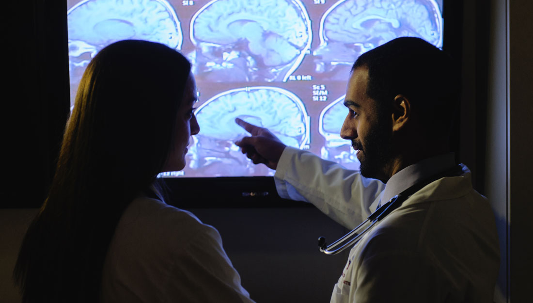 Doctors looking at brain scans