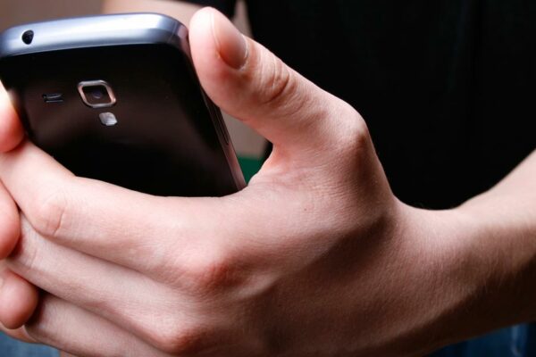 Man Holding Cell Phone