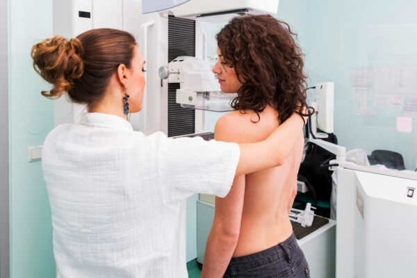 Women Receiving A Mammogram