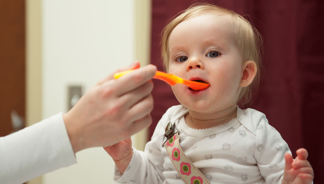 Baby eating solid food