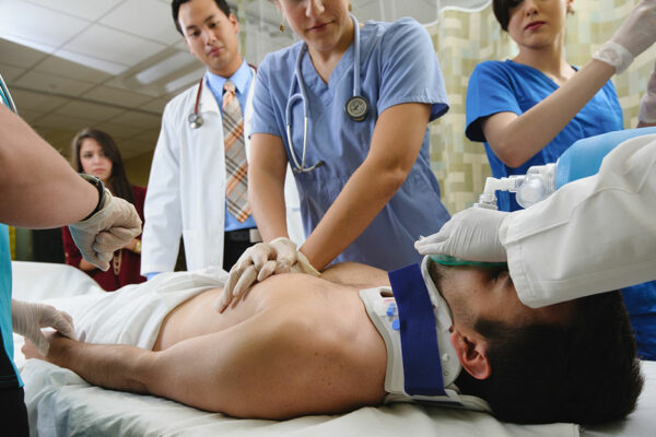 Different Health Professionals Working On Patient