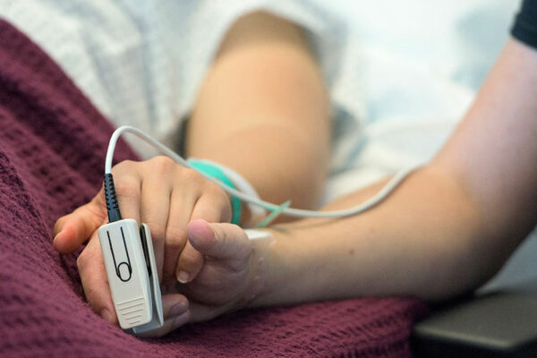 Patient Lying In Hospital Bed