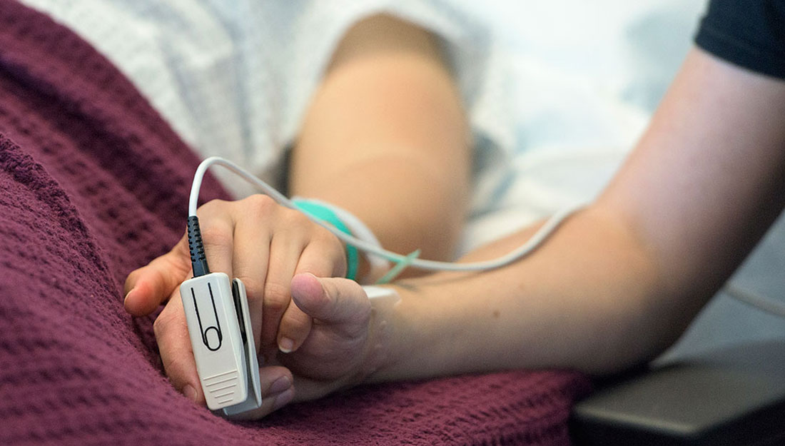 patient lying in hospital bed