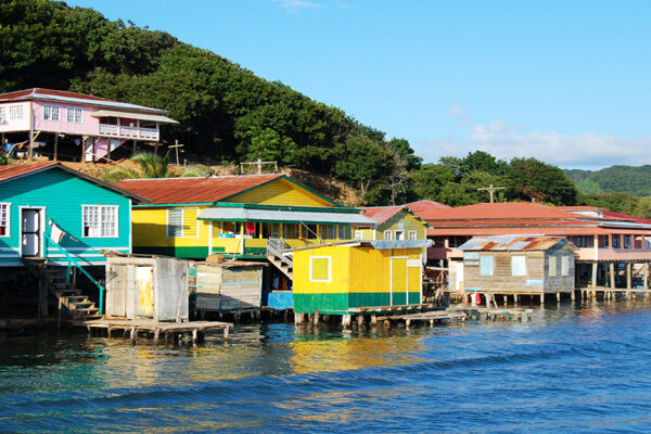 Houses Built On Stilts Along The Coast Of Roatan, Honduras