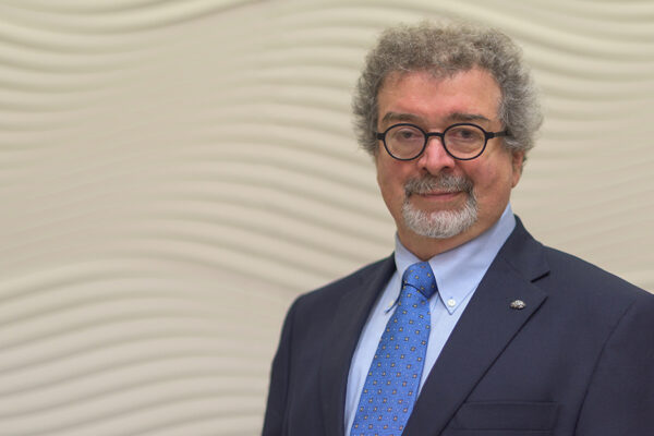 Israel Liberzon, MD, Stands In Lobby Of Texas A&M Health Science Center.