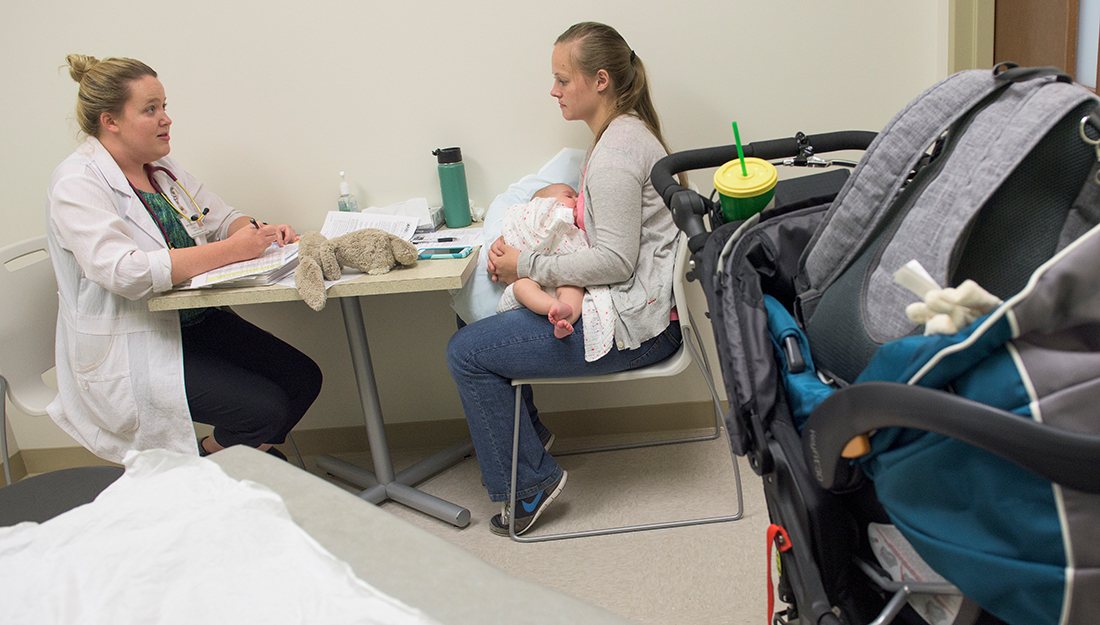 FNP student talking to young mother