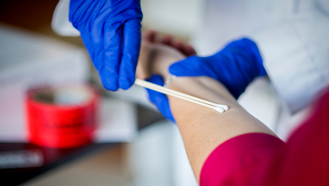 Forensic nurse examining patient