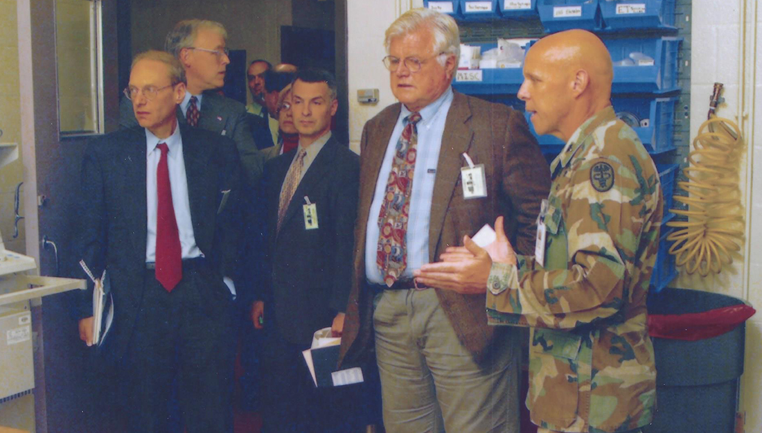 Army Nurse-Marklund standing next to different politicians including Senator Ted Kennedy