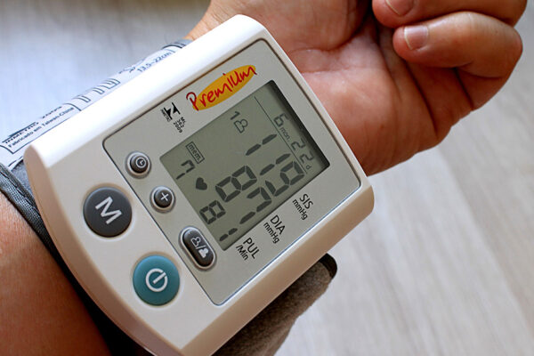 High Blood Pressure-a Blood Pressure Monitor On A Person's Wrist