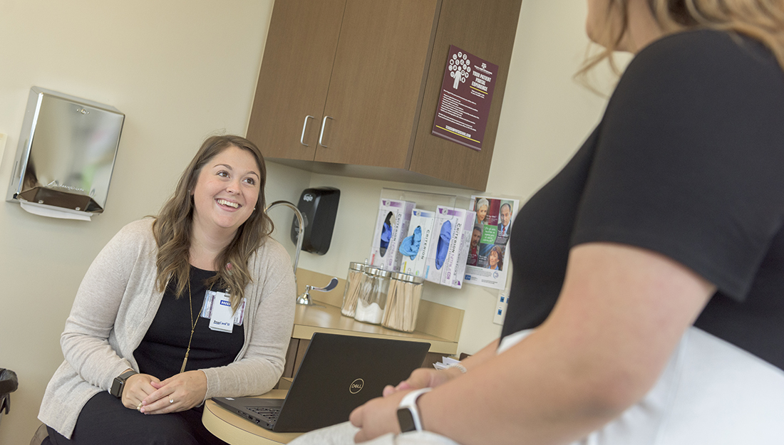 Doctor speaking to her patient