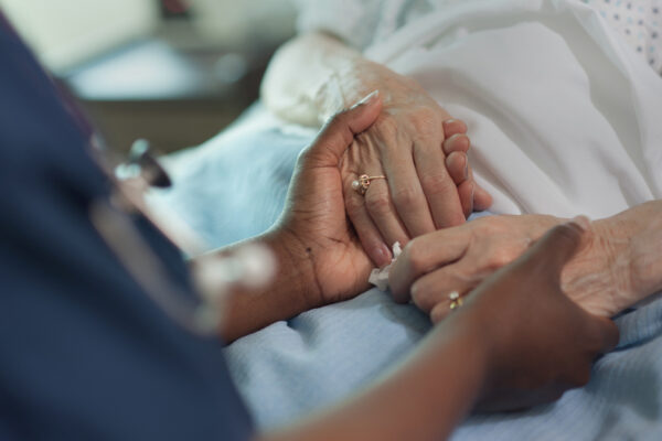 Nurse Comforting Older Patient