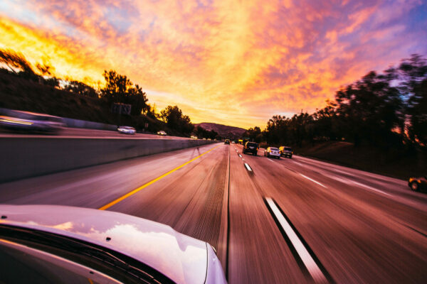 Cars Driving Down A Highway For Holiday Travel