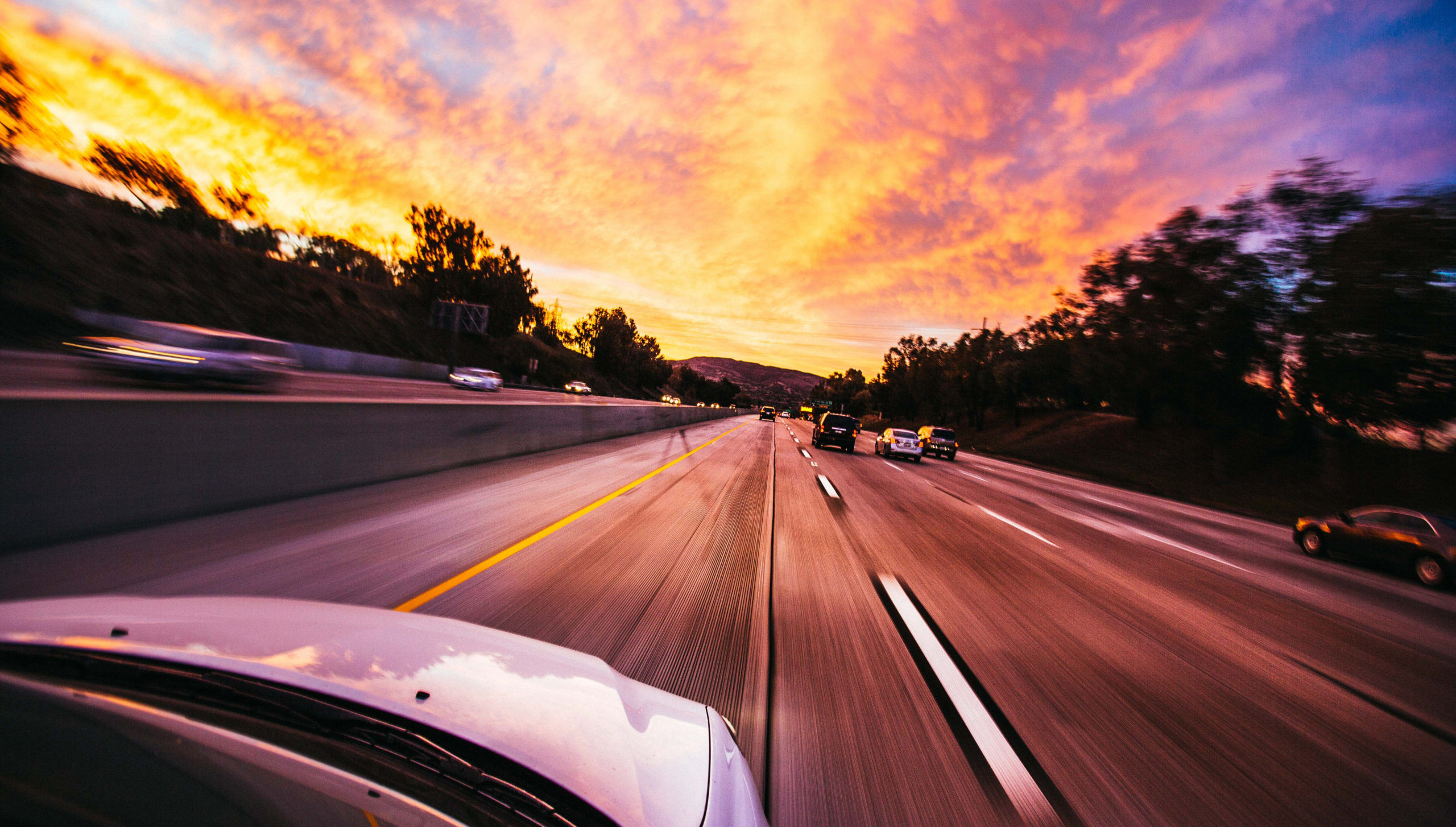 cars driving down a highway for holiday travel