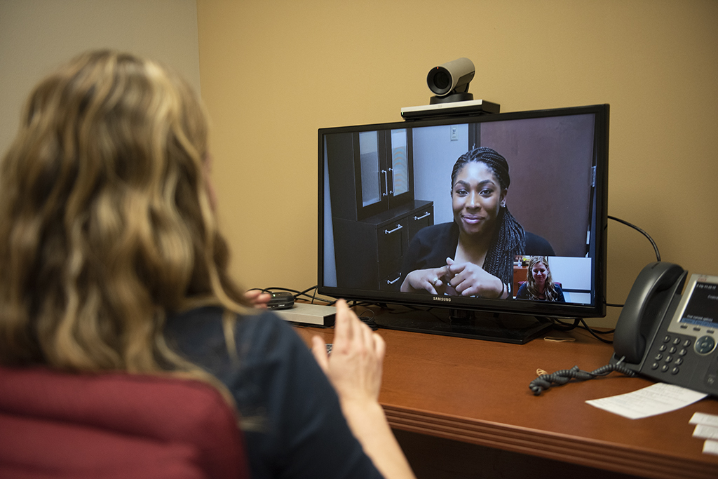 COVID-19_Telehealth_Telebehavioral care_Telemedicine_A woman speaks to another woman over the hipaa-approved software