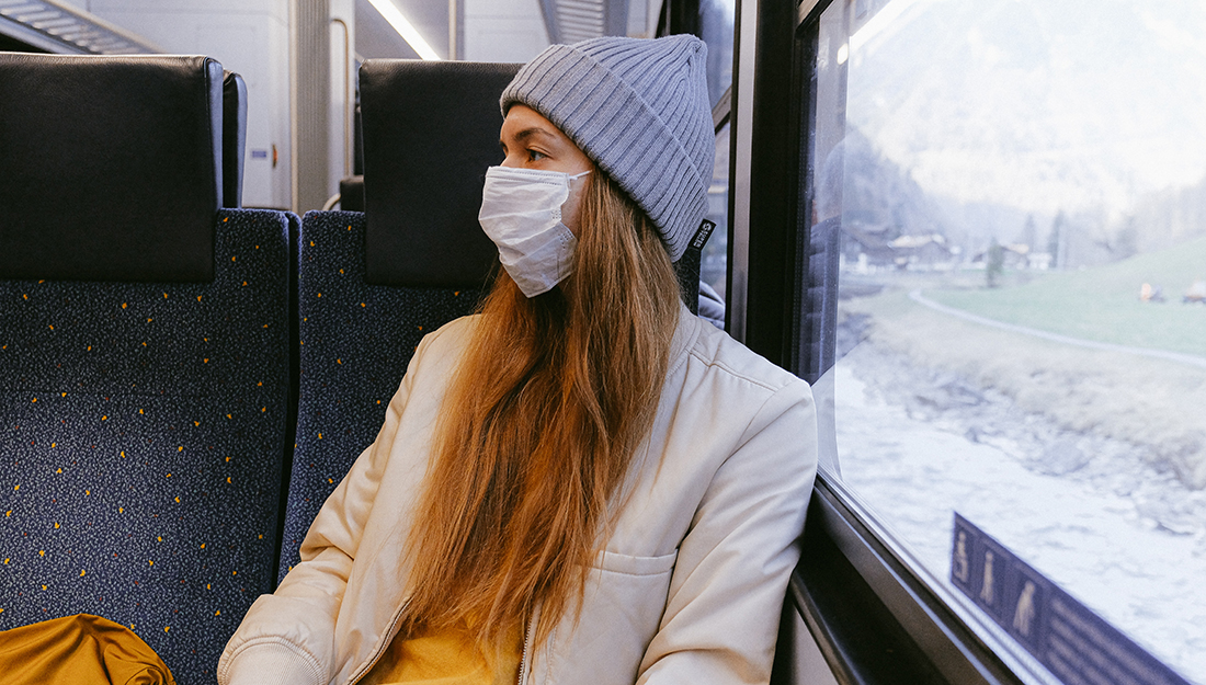 woman wearing a medical mask on a train