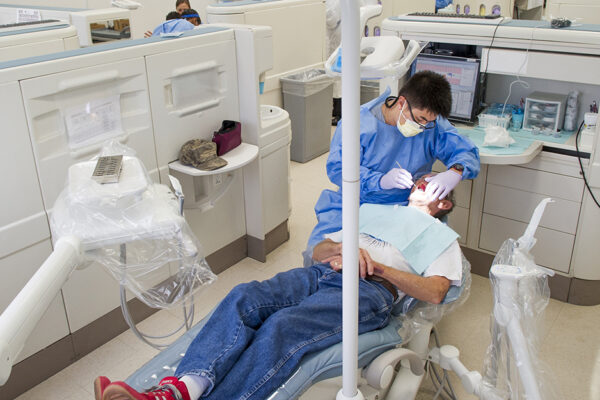 Dentist-working-with-patient-in-clinic