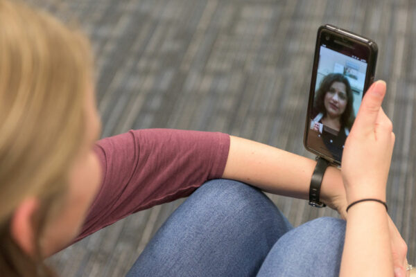 Woman Holding Phone, Talking With Doctor Over Telemedicine