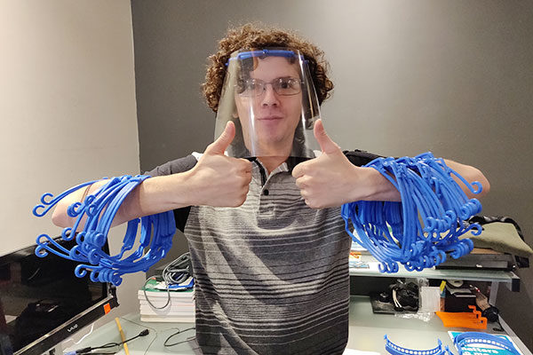 Texas A&M College of Pharmacy student, Humberto Ramos, wears a 3-D printed face shield