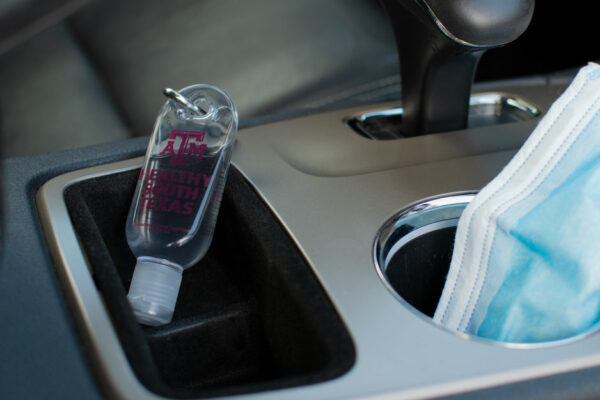 Bottle Of Hand Sanitizer In A Car Center Console