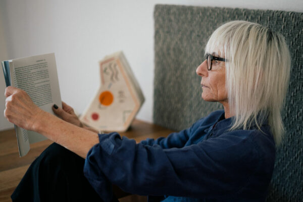 Older Woman Reading A Book