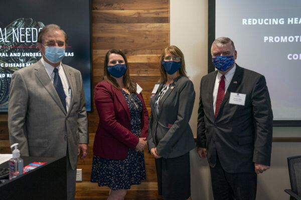 Photo Of Chancellor John Sharp, Dr. Jodie Gary, Dr. Nancy Downing And HRSA Administrator Thomas J. Engels Standing Together With Face Masks On