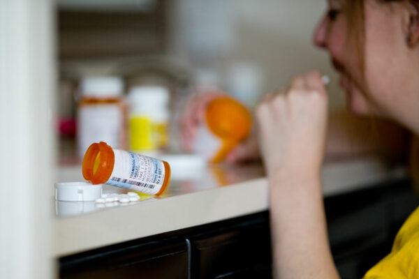 Bottle Of Opioids Open On A Counter