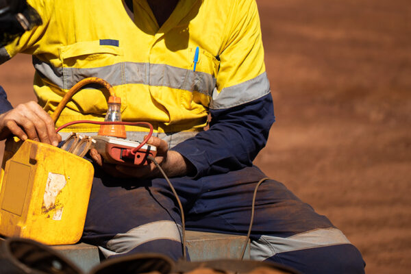 Electrician In Safety Gear Works