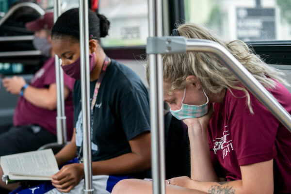 College Students Wearing Masks Ride Bus