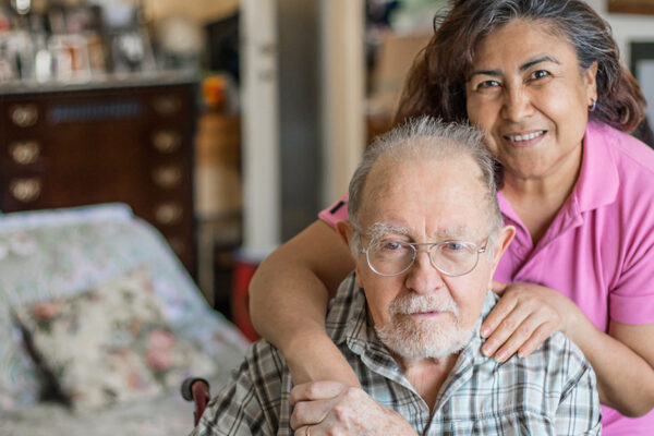 Senior Man With Their Caregiver At Home.