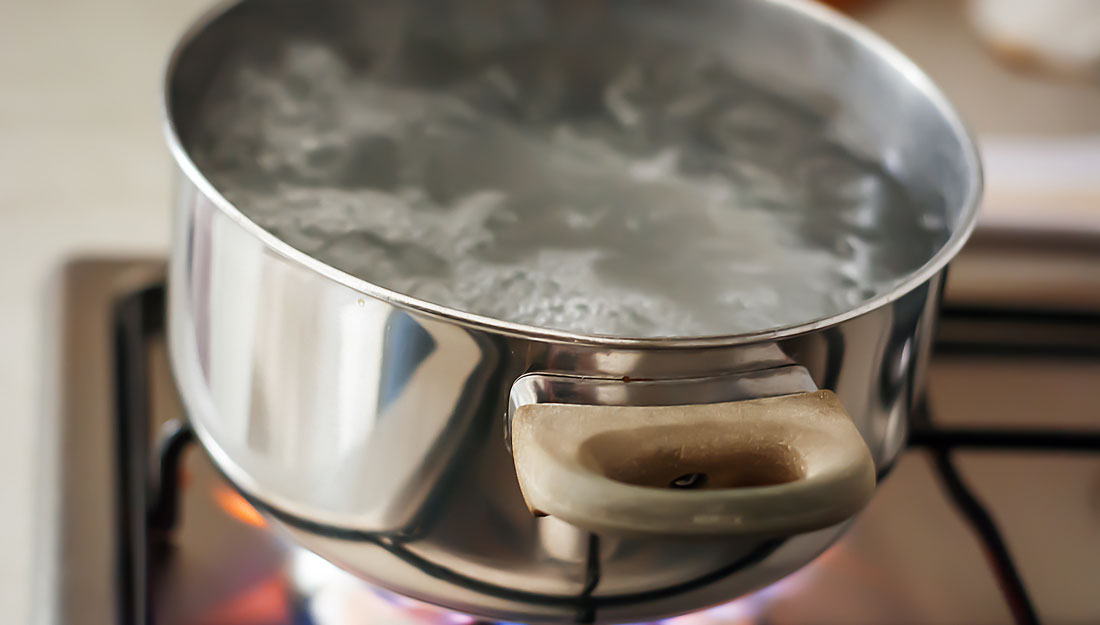 pot of water boils on gas stove