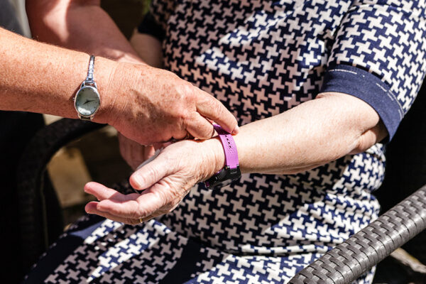 Old Womans Is Having Wearable Device Smart Watch In Care Home Retirement House.