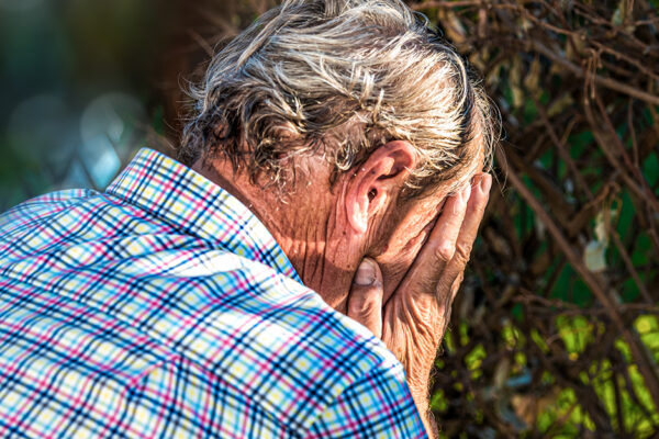 Older Man Worried And Hiding His Face In His Hands. Headache. Ad