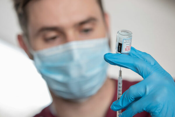 Health Professional Holds A Covid-19 Vaccine Vial