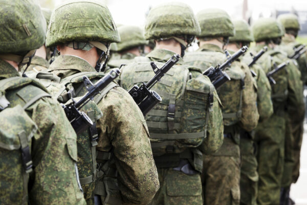 Soldiers Wearing Battle Dress Uniforms March In Formation