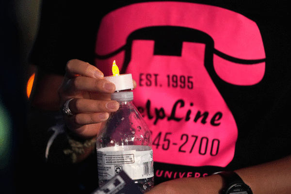 A Member Of The Campus Community Wears A HelpLine Shirt At The Not Another Aggie Kickoff On Sept. 7, 2022.