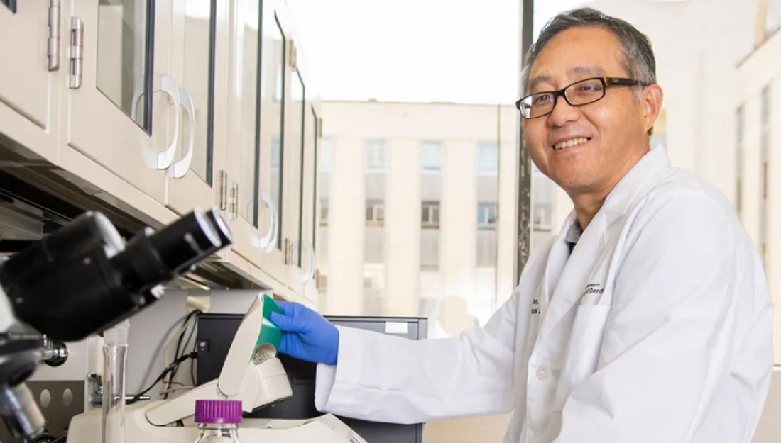 Dr. Feng Tao sits in a laboratory