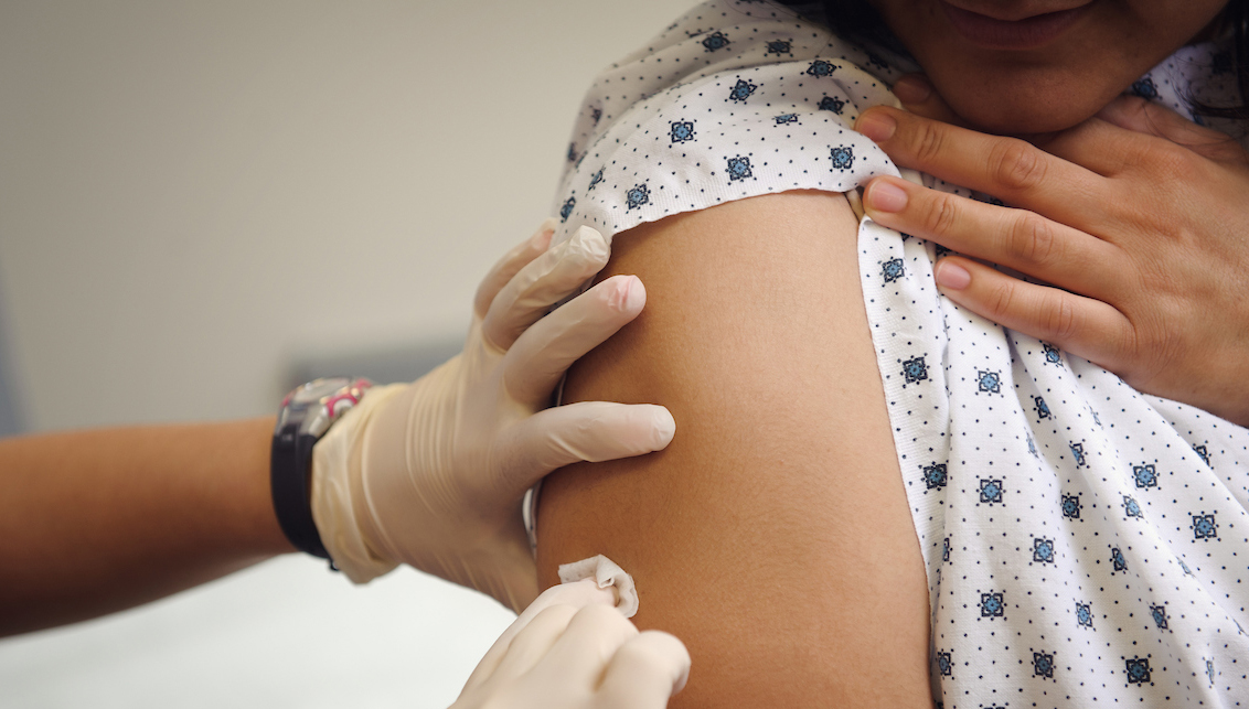 Person preparing for a vaccination