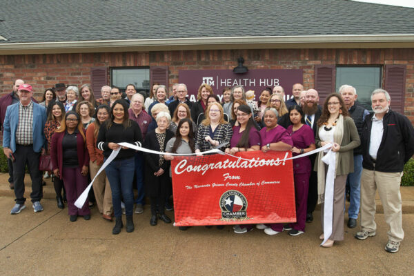 Representatives From Texas A&M Health, School Of Medicine, School Of Nursing, Navasota Chamber Of Commerce And Texas Legislature Stand Together For The Ribbon Cutting In Front Of The Texas A&M Health Hub In Navasota