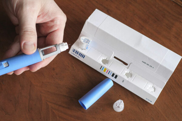 Man Prepares An Injection Of Ozempic, A Diabetes Weight Loss Drug