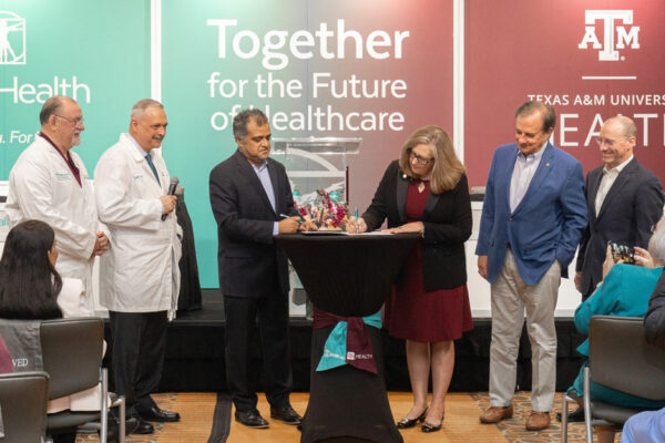 Leaders From Texas A&M And DHR Health Take Part In A Ceremonial Signing Event