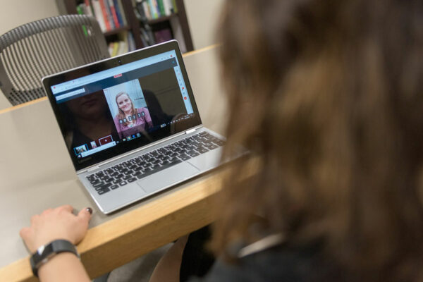 Woman Uses Laptop For Telehealth